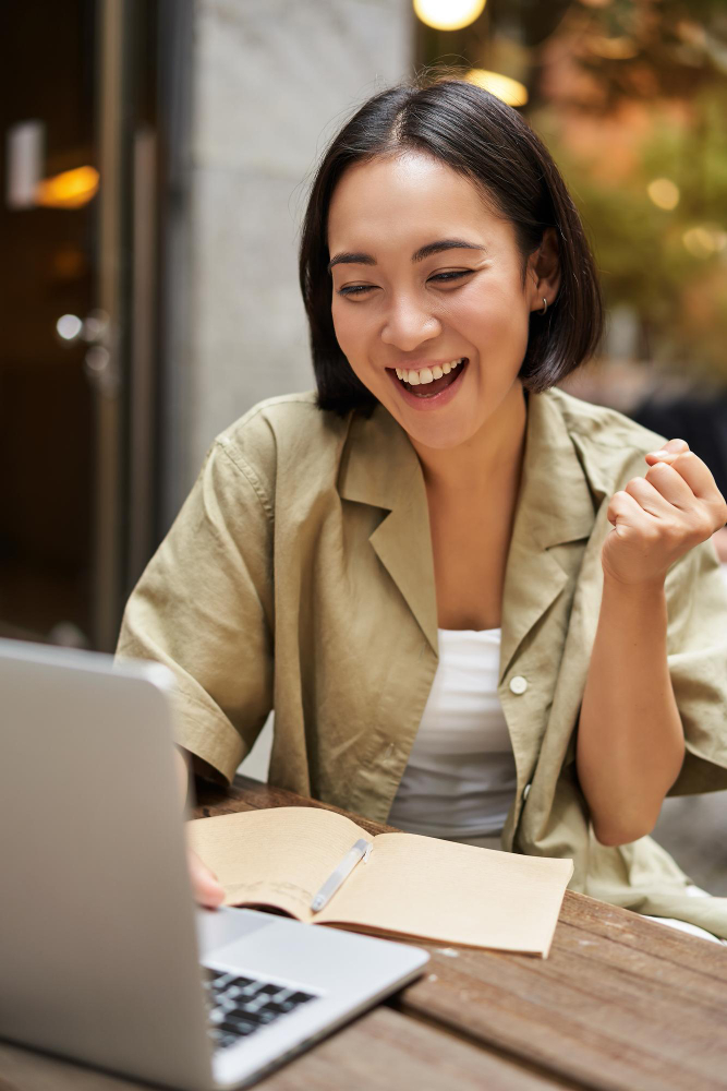 Young woman smiling outside office building