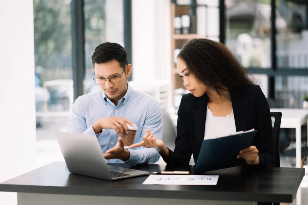 two-asian-businesswoman-and-man-discuss-investment-2026-01-05-23-24-03-utc two-asian-businesswoman-and-man-discuss-investment-2026-01-05-23-24-03-utc